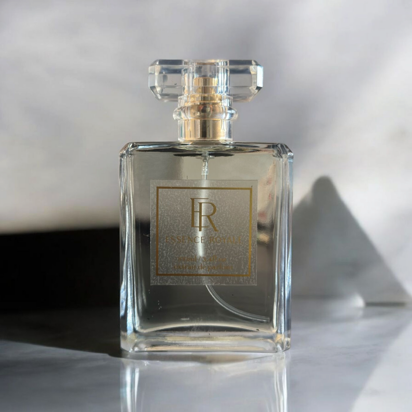 Artistic shot of Heaven bottle surrounded by vanilla pods and oud wood